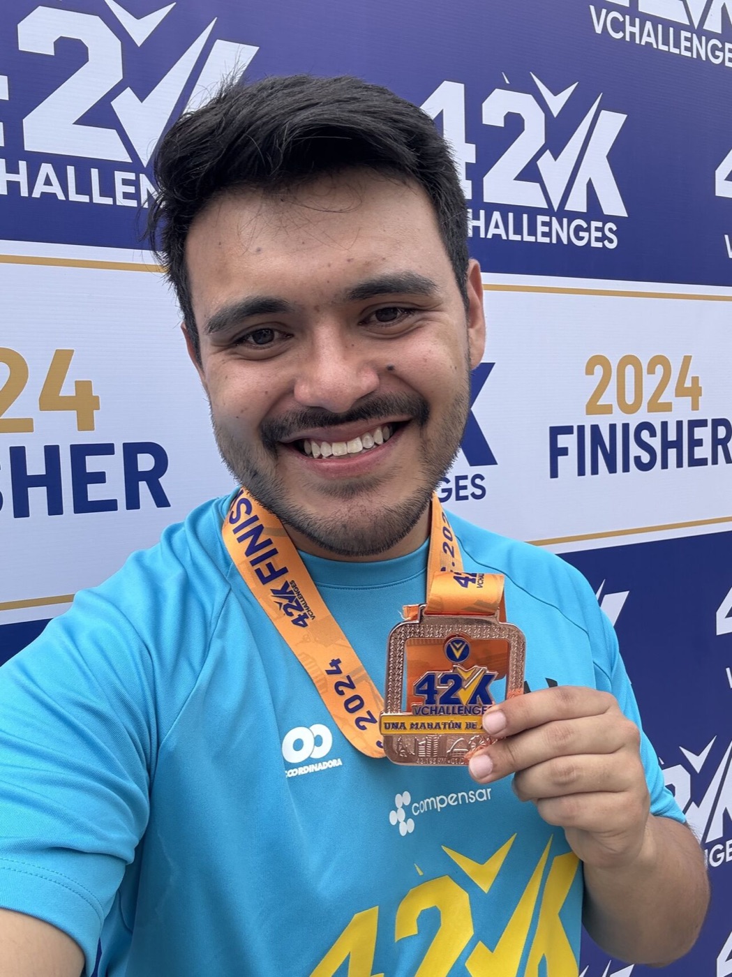 Kevin with the 42K Challenges 2024 finisher medal